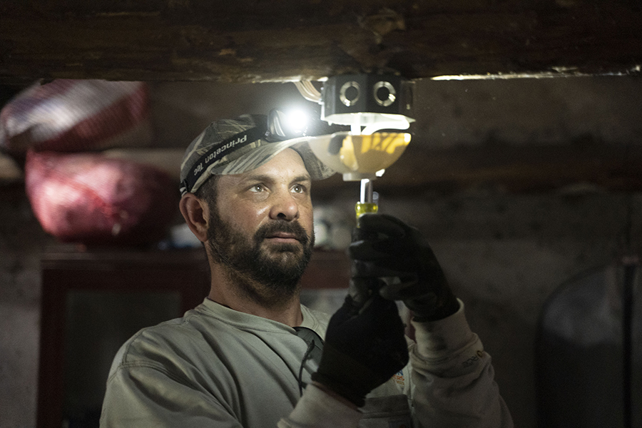 lineworker installing light fixture